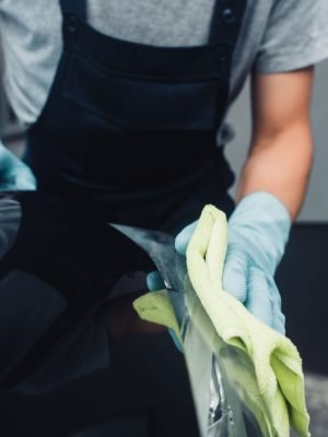 cropped-view-of-car-cleaner-in-overalls-wiping-car-2023-11-27-05-09-45-utc-1536x1025